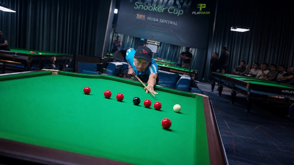 Player takes a key shot during the snooker final